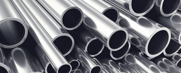 Heap of shiny metal steel pipes with selective focus effect, 3d illustration